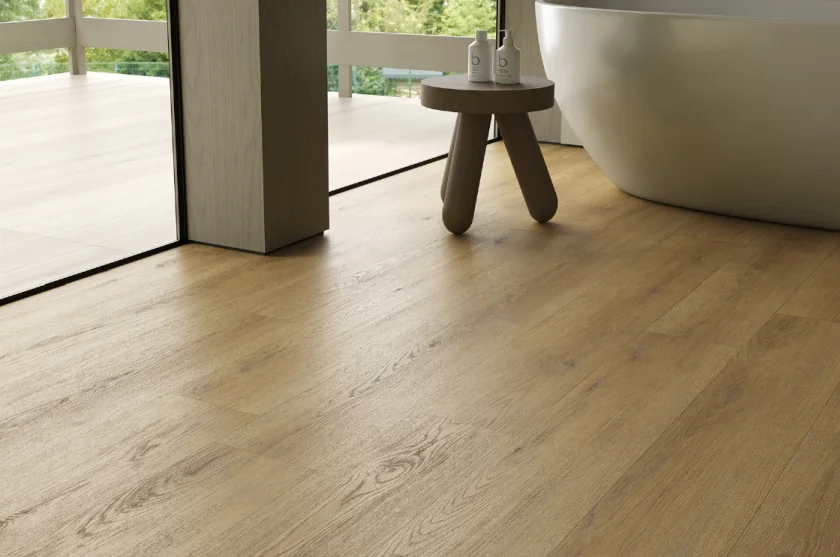 Natural light falling across a warm wood-look floor